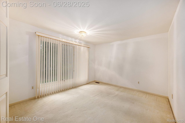 2184 Reagan Dr, Rochester Hills, MI 48309 - spare room featuring carpet floors and baseboards