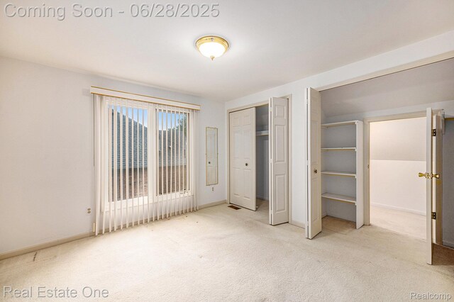 2184 Reagan Dr, Rochester Hills, MI 48309 - unfurnished bedroom featuring carpet floors and baseboards