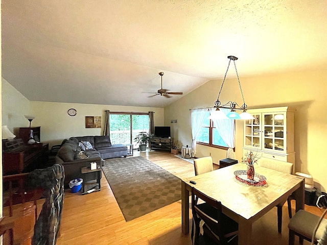 5753 Wood Valley Rd, Kalamazoo, MI 49009 - dining area featuring wood finished floors, a ceiling fan, and lofted ceiling
