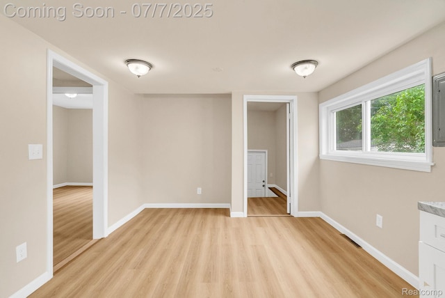 8716 Jewett Ave, Warren, MI 48089 - empty room with light wood-style floors and baseboards