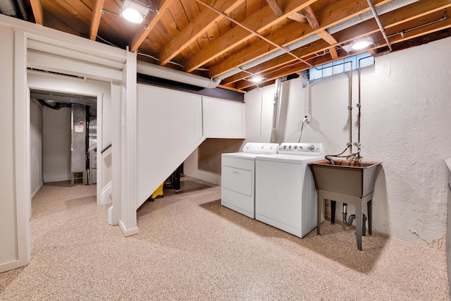 27152 Broadmoor Dr, Warren, MI 48088 - unfinished basement featuring washing machine and dryer, a textured wall, light colored carpet, and stairs