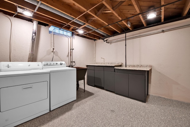 27152 Broadmoor Dr, Warren, MI 48088 - laundry area featuring separate washer and dryer, cabinet space, and light carpet