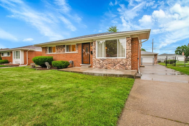 27152 Broadmoor Dr, Warren, MI 48088 - view of front of home with a front lawn, stone siding, a detached garage, and brick siding
