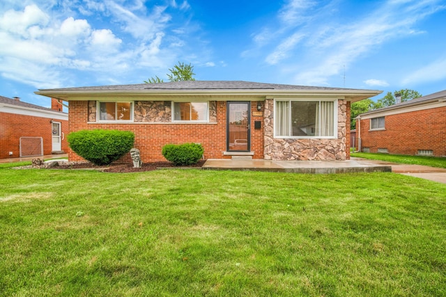 27152 Broadmoor Dr, Warren, MI 48088 - view of front of home featuring a front lawn, stone siding, and brick siding
