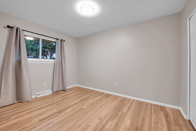 27152 Broadmoor Dr, Warren, MI 48088 - unfurnished room with light wood-style floors and baseboards
