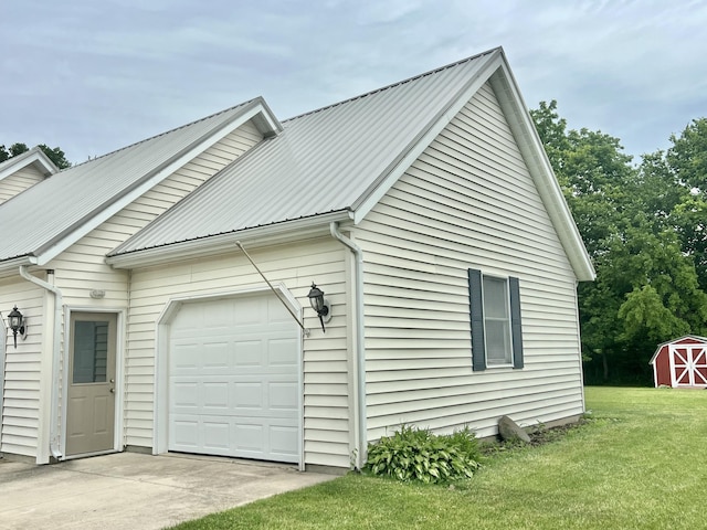 755 Tomahawk Trl, Coldwater, MI 49036 - view of side of property with an attached garage, a metal roof, a storage shed, a yard, and driveway