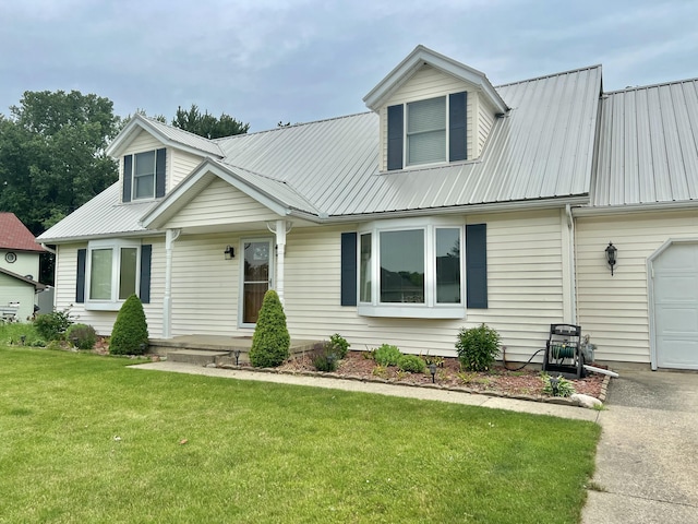 755 Tomahawk Trl, Coldwater, MI 49036 - view of front facade with a metal roof, a garage, and a front lawn