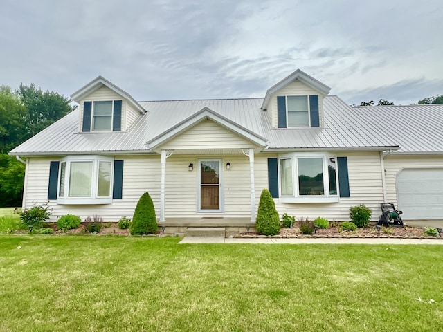 755 Tomahawk Trl, Coldwater, MI 49036 - view of front of house featuring a metal roof, a garage, and a front yard