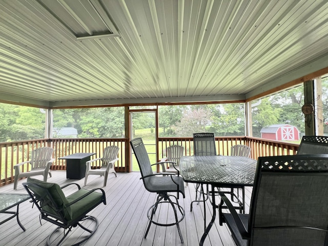 755 Tomahawk Trl, Coldwater, MI 49036 - wooden deck with outdoor dining space and a storage unit