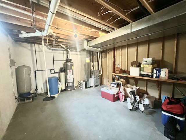 755 Tomahawk Trl, Coldwater, MI 49036 - unfinished below grade area with gas water heater, heating unit, a water pressure tank, and a water softener