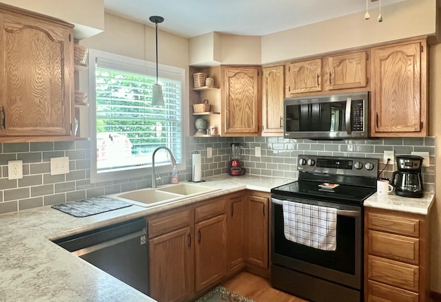 755 Tomahawk Trl, Coldwater, MI 49036 - kitchen featuring appliances with stainless steel finishes, light countertops, open shelves, and decorative backsplash