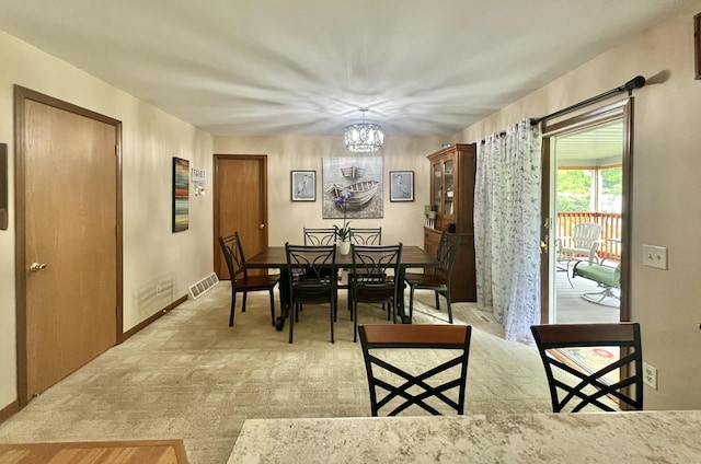 755 Tomahawk Trl, Coldwater, MI 49036 - dining space with a chandelier and light colored carpet