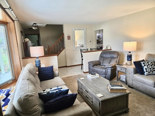 755 Tomahawk Trl, Coldwater, MI 49036 - carpeted living area with plenty of natural light, tile patterned floors, and stairs
