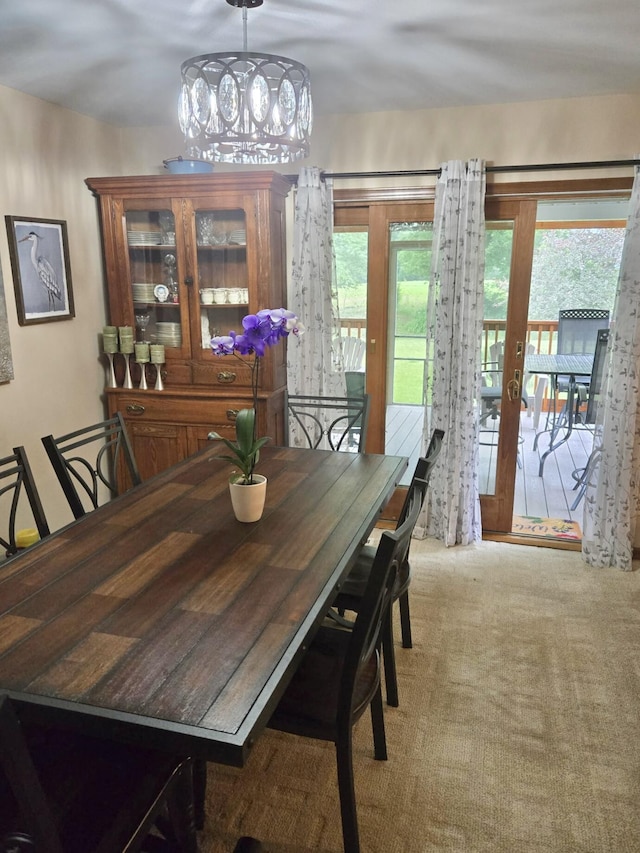 755 Tomahawk Trl, Coldwater, MI 49036 - dining space featuring carpet, french doors, and a chandelier