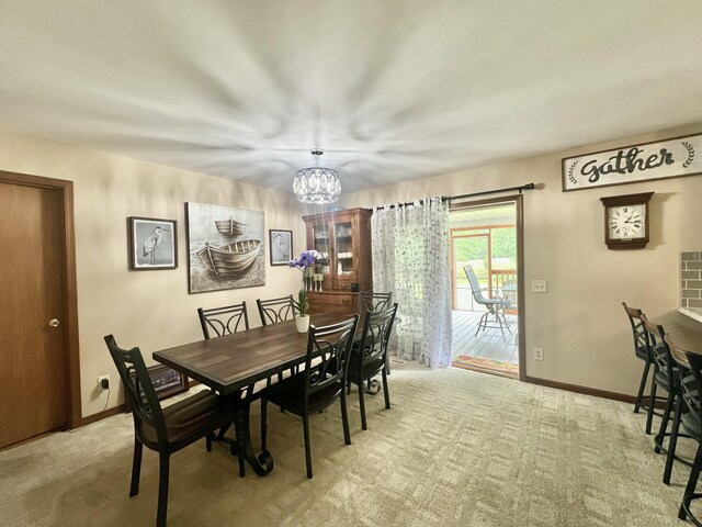 755 Tomahawk Trl, Coldwater, MI 49036 - dining area featuring a chandelier and carpet