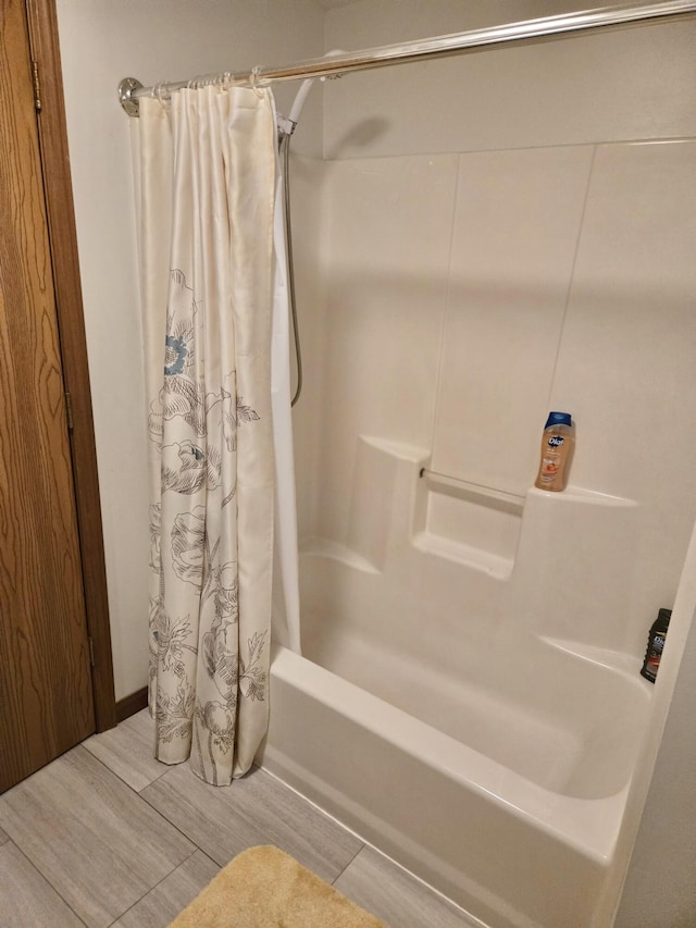 755 Tomahawk Trl, Coldwater, MI 49036 - full bathroom with shower / bath combination with curtain and wood finish floors