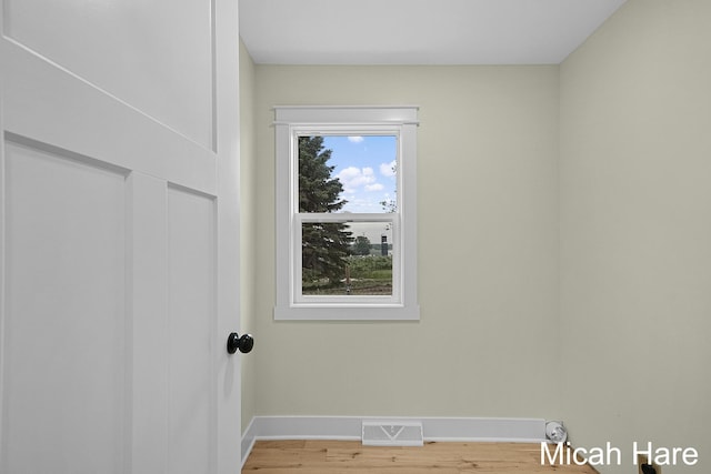 3054 Sehler St, Conklin, MI 49403 - empty room with baseboards and wood finished floors