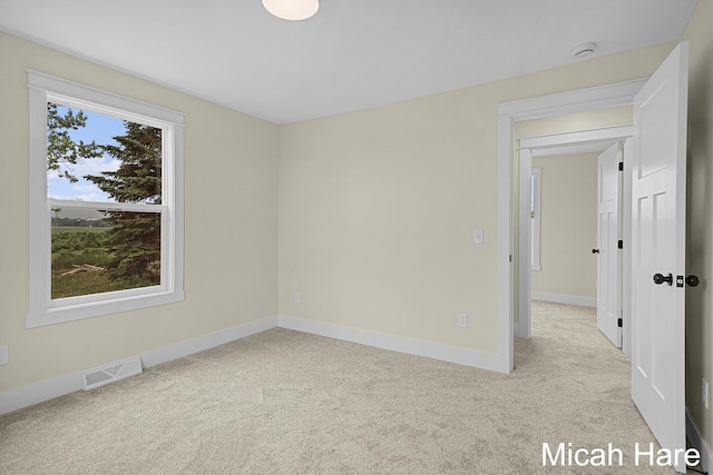 3054 Sehler St, Conklin, MI 49403 - carpeted spare room with baseboards and a smoke detector