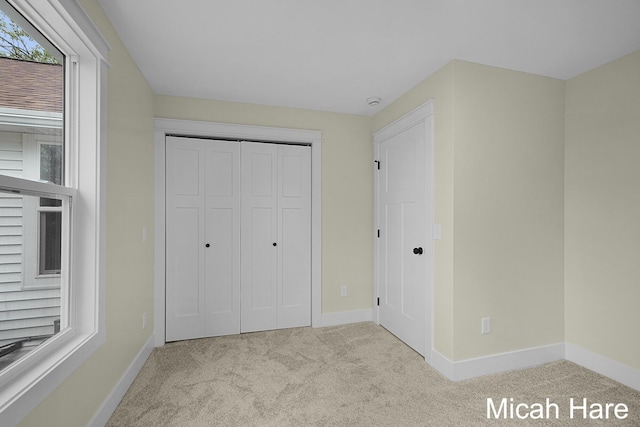 3054 Sehler St, Conklin, MI 49403 - unfurnished bedroom featuring carpet floors and a closet