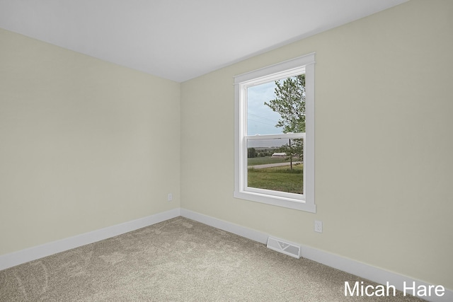 3054 Sehler St, Conklin, MI 49403 - carpeted empty room featuring baseboards