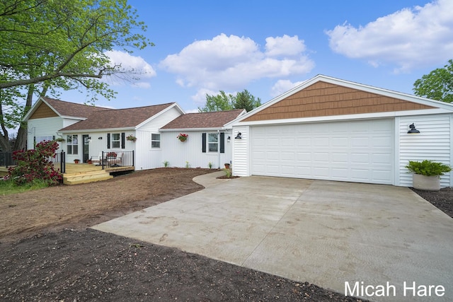 3054 Sehler St, Conklin, MI 49403 - ranch-style home with driveway, a garage, a deck, and a shingled roof