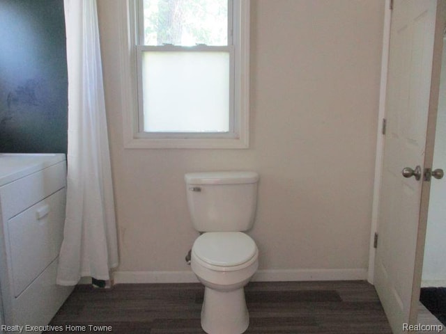 1027 Elmwood St, Port Huron, MI 48060 - bathroom featuring healthy amount of natural light, wood finished floors, vanity, and washer / clothes dryer