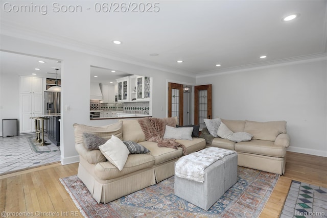 753 Grand Marais St, Grosse Pointe Park, MI 48230 - living room with light wood-style flooring, ornamental molding, and recessed lighting