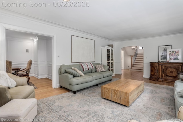753 Grand Marais St, Grosse Pointe Park, MI 48230 - living area with wood finished floors, ornamental molding, arched walkways, and stairway