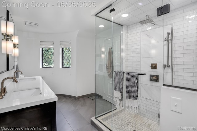753 Grand Marais St, Grosse Pointe Park, MI 48230 - bathroom with double vanity, a stall shower, and tile patterned floors