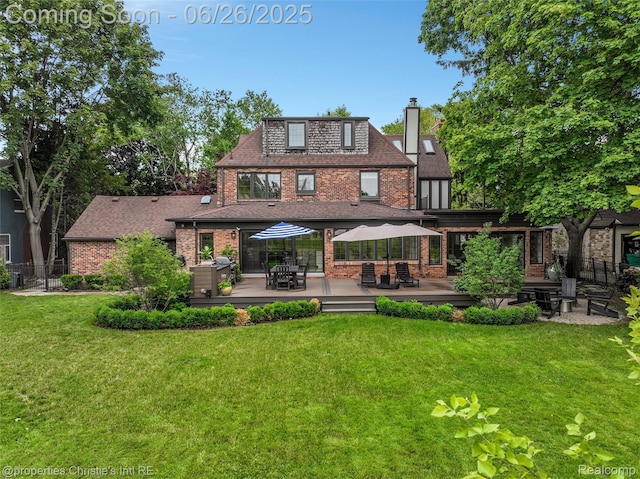 753 Grand Marais St, Grosse Pointe Park, MI 48230 - back of property with brick siding, a deck, a chimney, outdoor dining space, and a shingled roof