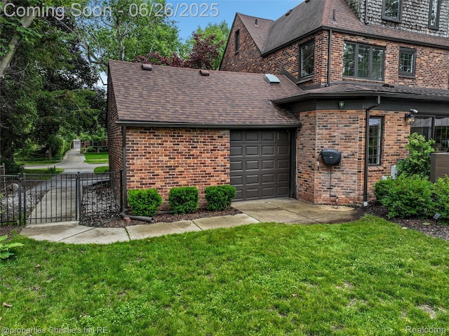 753 Grand Marais St, Grosse Pointe Park, MI 48230 - back of property featuring brick siding, an attached garage, a shingled roof, and a gate