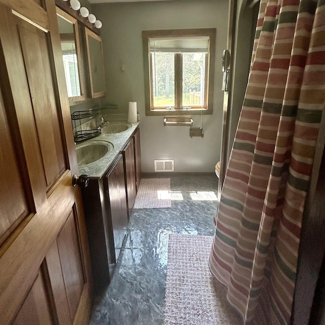 218 W Stover Rd, Standish, MI 48658 - full bath with double vanity and toilet