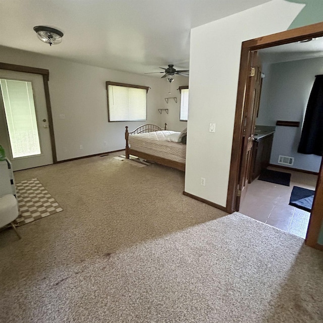 218 W Stover Rd, Standish, MI 48658 - unfurnished bedroom with carpet flooring and ceiling fan