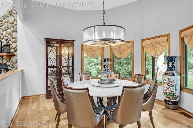 2300 Canyon Ridge Dr, White Lake, MI 48383 - dining area with light wood-style flooring and baseboards