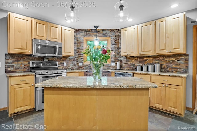 2300 Canyon Ridge Dr, White Lake, MI 48383 - kitchen featuring stainless steel appliances, light brown cabinetry, decorative backsplash, a kitchen island, and light stone counters