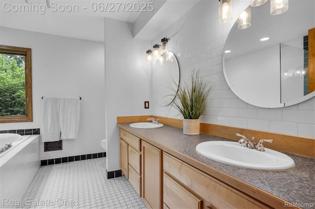 2300 Canyon Ridge Dr, White Lake, MI 48383 - bathroom with double vanity, a garden tub, and decorative backsplash