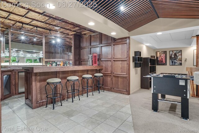2300 Canyon Ridge Dr, White Lake, MI 48383 - indoor bar featuring lofted ceiling and baseboards