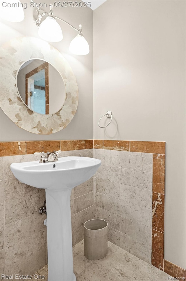2300 Canyon Ridge Dr, White Lake, MI 48383 - bathroom with tile walls and a wainscoted wall