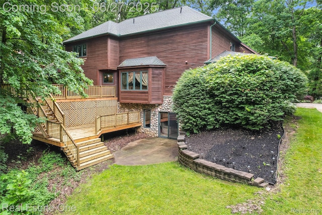 2300 Canyon Ridge Dr, White Lake, MI 48383 - rear view of house featuring stone siding, stairs, a deck, and a yard