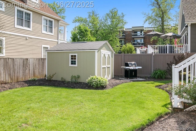 229 Huron St, South Haven, MI 49090 - fenced backyard featuring a storage unit
