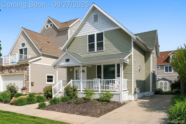 229 Huron St, South Haven, MI 49090 - view of front of property featuring a porch, a storage unit, and concrete driveway