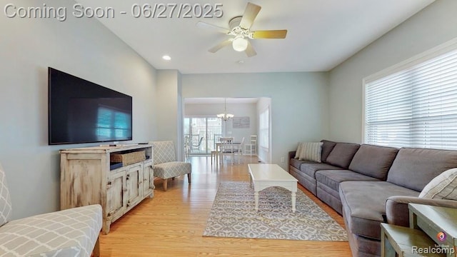 229 Huron St, South Haven, MI 49090 - living room featuring light wood-type flooring, a ceiling fan, a chandelier, and recessed lighting