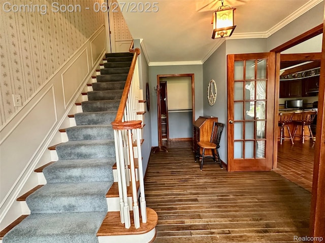 9276 Old Plank Ln, Brighton, MI 48114 - stairs featuring hardwood / wood-style flooring and ornamental molding
