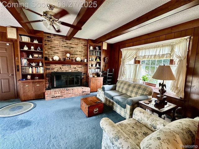 9276 Old Plank Ln, Brighton, MI 48114 - living room with a textured ceiling, wood walls, carpet flooring, beamed ceiling, and a ceiling fan