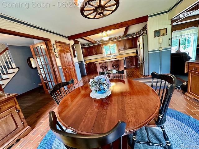 9276 Old Plank Ln, Brighton, MI 48114 - dining area with a chandelier, beamed ceiling, brick patterned flooring, and crown molding