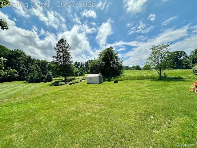 9276 Old Plank Ln, Brighton, MI 48114 - view of grassy yard with a storage shed