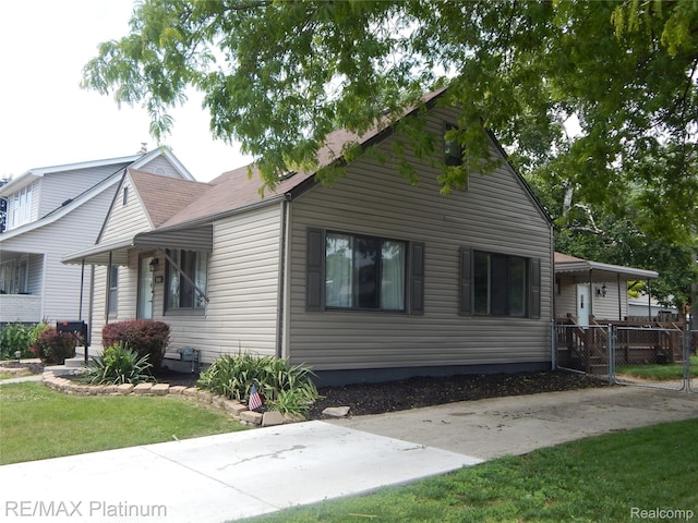 22133 Rosedale St, Saint Clair Shores, MI 48080 - view of home's exterior with a yard