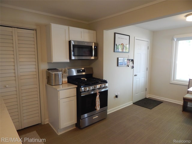 22133 Rosedale St, Saint Clair Shores, MI 48080 - kitchen featuring stainless steel appliances, white cabinetry, light countertops, and crown molding