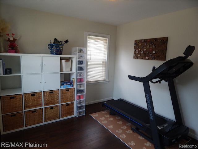 22133 Rosedale St, Saint Clair Shores, MI 48080 - exercise room with dark wood-type flooring and baseboards