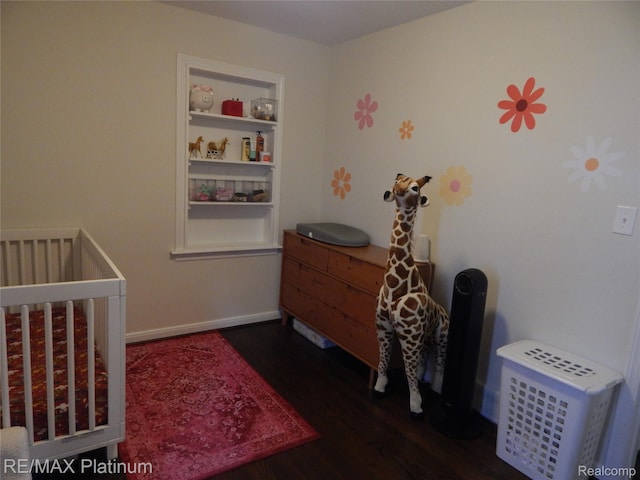 22133 Rosedale St, Saint Clair Shores, MI 48080 - bedroom featuring dark wood-style floors and a crib